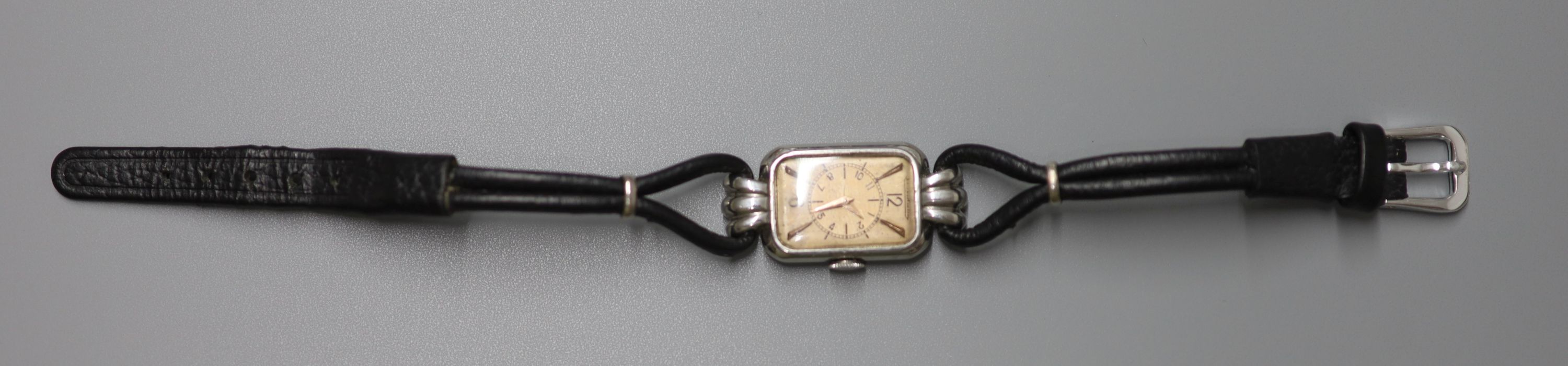 A lady's Art Deco stainless steel Jaeger LeCoultre rectangular dial wrist watch, on a fabric twin strand strap